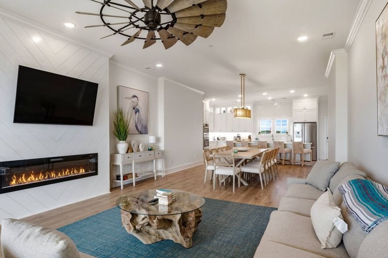 Living area fireplace and dining beyond